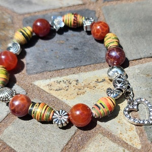 Fire agate gemstones with glazed paper beads-beautiful heart shaped charm! Provides stability and balance in times of chaos and upheaval!
