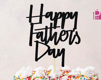 May include: Black glitter cake topper with the text "Happy Father's Day" on a white cake with colorful sprinkles.