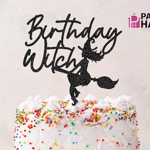 May include: Black glitter cake topper with the text "Birthday Witch" and a silhouette of a witch flying on a broomstick.