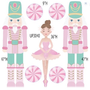 May include: Two pink and green nutcracker figures stand on either side of a ballerina doll. The ballerina is wearing a pink tutu and has brown hair. There are four pink and white candy cane ornaments around the figures. The text "UP3040" is written above the ballerina. The text "47"H" is written below each nutcracker and the text "36"H" is written below the ballerina. The text "9"H" is written above each candy cane ornament.