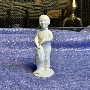 ceramics of little boy holding a fish pole for outdoors Ceramic Fishing Boy