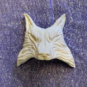 May include: White ceramic fox head wall sculpture with detailed fur texture.