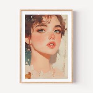 Peut inclure: Une impression d'art numérique encadrée représentant le portrait d'une personne aux cheveux bruns, aux yeux bleus et au teint clair. L'œuvre utilise des tons chauds et doux avec des textures de coups de pinceau visibles, dans un cadre en bois clair.