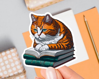 May include: A sticker featuring an orange and white tabby cat reading a stack of three books. The cat is sitting on the books with its paws resting on the top book. The cat has a serious expression on its face.