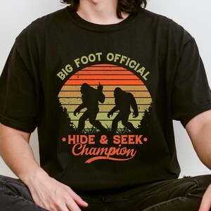 Bigfoot Hide and Seek Champion Shirt, Sasquatch Funny Graphic T, Cryptid Lover Gift, Vintage Retro Style Bigfoot T-shirt, Outdoors Adventure