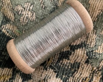 Whole spool of antique silver embroidery thread