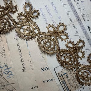 1 segment of antique gold metal thread roccoco trim