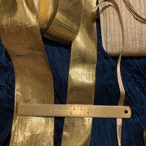 Antique gold French metal wired metallic ribbon, beautiful rich gold. Sold by the meter. Assorted widths. Perfect for presents