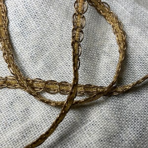 1 m of antique gold ribbon trim braid. Dolls trim
