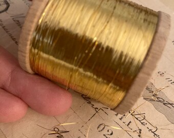 Whole spool of 1900s antique gold metal thread. Hundreds of meters