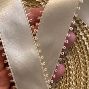 1 meter of Ivory double sided satin ribbon.
