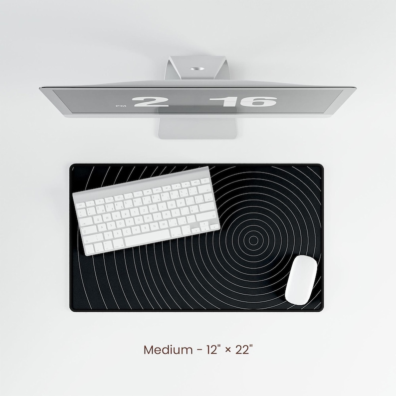May include: A black and white circular pattern mouse pad with a white keyboard and white mouse on top. The mouse pad is 12 inches by 22 inches.