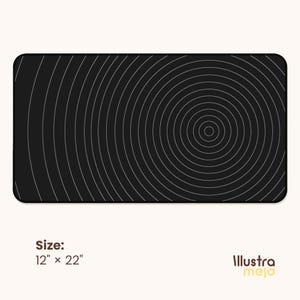 May include: Black and white circular pattern mouse pad with a concentric circle design. The mouse pad measures 12 inches by 22 inches.
