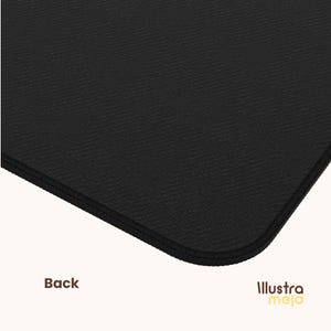 May include: Black yoga mat with a textured surface. The mat has a stitched edge.