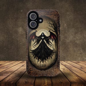 May include: A phone case with a gothic design featuring a woman with wings and the word "Lilith" in a decorative frame.