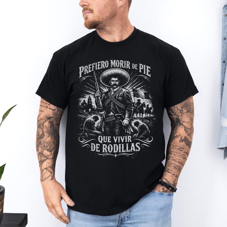Emiliano Zapata unisex t-shirt featuring a powerful illustrated portrait of the Mexican revolutionary leader, inspired by the Mexican Revolution. This rebel spirit history shirt honors Emiliano Zapata’s fight for justice, land reform, and freedom, celebrating Latin heritage, revolutionary symbolism, and iconic Mexican history in a bold, striking design.