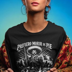 Emiliano Zapata unisex t-shirt featuring a powerful illustrated portrait of the Mexican revolutionary leader, inspired by the Mexican Revolution. This rebel spirit history shirt honors Emiliano Zapata’s fight for justice, land reform, and freedom, celebrating Latin heritage, revolutionary symbolism, and iconic Mexican history in a bold, striking design.