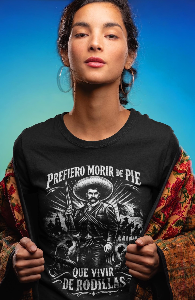 Emiliano Zapata unisex t-shirt featuring a powerful illustrated portrait of the Mexican revolutionary leader, inspired by the Mexican Revolution. This rebel spirit history shirt honors Emiliano Zapata’s fight for justice, land reform, and freedom, celebrating Latin heritage, revolutionary symbolism, and iconic Mexican history in a bold, striking design.