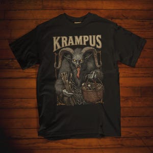 Dark Krampus Christmas shirt featuring the legendary holiday demon from Alpine folklore, perfect for fans of gothic fashion, pagan style, and alternative holiday apparel.