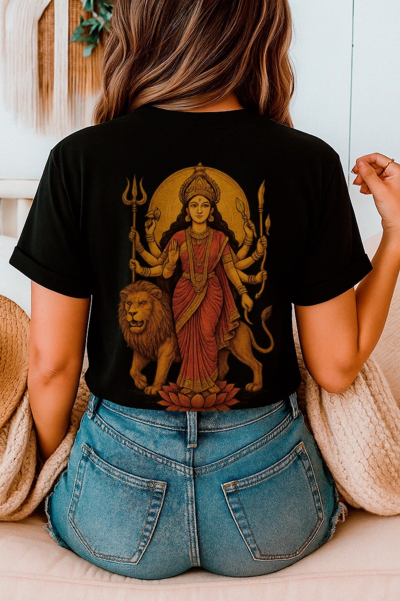 “Maa Durga T-shirt featuring the Hindu goddess of strength and protection, perfect for devotees of the divine feminine and Shakti power. Spiritual yoga clothing with sacred iconography, ideal for those seeking a powerful and meaningful Hindu goddess tee.