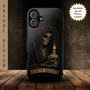 May include: Black phone case featuring a detailed illustration of Santa Muerte, a skeletal figure adorned with roses, holding a candle and a skull. The case has the text "SANTA MUERTE" and "Available for all iPhone models". The design is set against a dark background.
