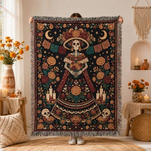 La Catrina woven blanket featuring colorful Dia de los Muertos folk art and an elegant calavera woman design. A striking Day of the Dead wall hanging, Mexican folk art tapestry, or decorative throw for gothic and sugar skull decor lovers, and a unique calavera gift inspired by traditional Mexican imagery.