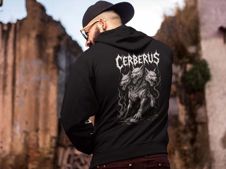 Cerberus Hoodie featuring a three-headed hellhound design inspired by Greek mythology. Gothic sweatshirt perfect for metalheads. Hades guardian graphic, ideal heavy metal gift for fans of dark fantasy and mythology