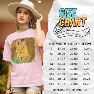 Distressed style t-shirt featuring Gustav Klimt painting The Kiss, rendered in faded gold and black tones on soft, white cotton fabric, suitable for art lovers.