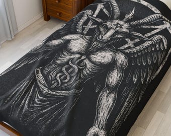 May include: Black and white graphic of a horned figure with wings, a pentagram, and a caduceus symbol on a black blanket. The blanket is on a wooden bed frame. The artwork is detailed and appears to be a print.