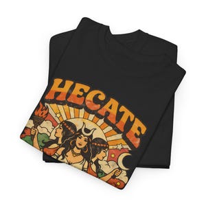 Vintage 70s Hecate retro shirt featuring the Triple Goddess in a mystical boho design, inspired by witchcraft, Wiccan and pagan spirituality. This witchy graphic tee shows Hekate with moon phases and occult symbols, perfect for spiritual women, witches, and lovers of magic. Ideal witchy gift for Wiccan, pagan and boho aesthetic fans.