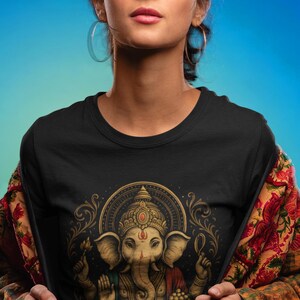 Spiritual Ganesha T-shirt featuring Hindu Elephant God design. Perfect for yoga, meditation, and spiritual gifts. Boho Indian graphic tee celebrating divine feminine energy and peaceful vibes.