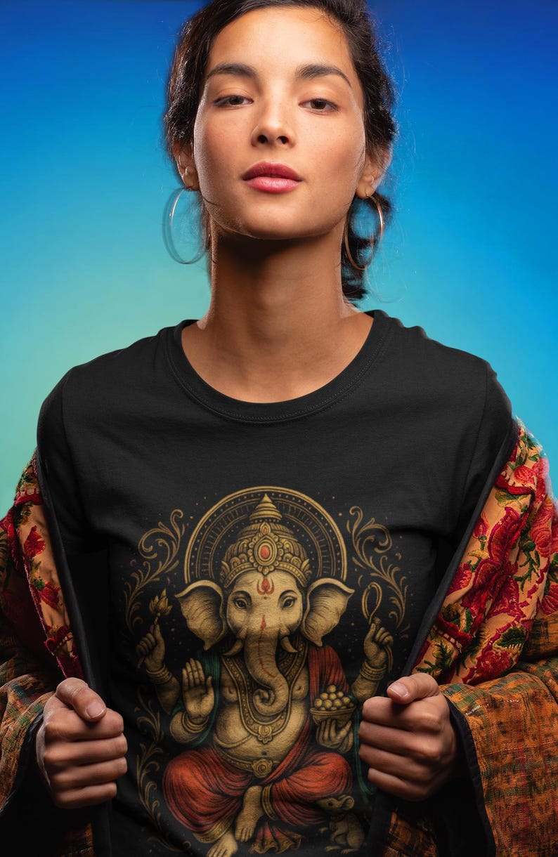 Spiritual Ganesha T-shirt featuring Hindu Elephant God design. Perfect for yoga, meditation, and spiritual gifts. Boho Indian graphic tee celebrating divine feminine energy and peaceful vibes.