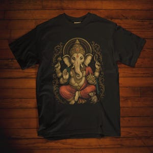 Spiritual Ganesha T-shirt featuring Hindu Elephant God design. Perfect for yoga, meditation, and spiritual gifts. Boho Indian graphic tee celebrating divine feminine energy and peaceful vibes.