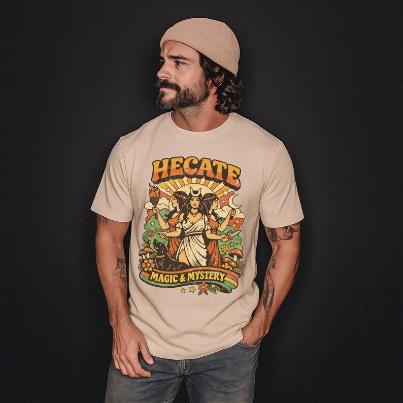 Vintage 70s Hecate retro shirt featuring the Triple Goddess in a mystical boho design, inspired by witchcraft, Wiccan and pagan spirituality. This witchy graphic tee shows Hekate with moon phases and occult symbols, perfect for spiritual women, witches, and lovers of magic. Ideal witchy gift for Wiccan, pagan and boho aesthetic fans.