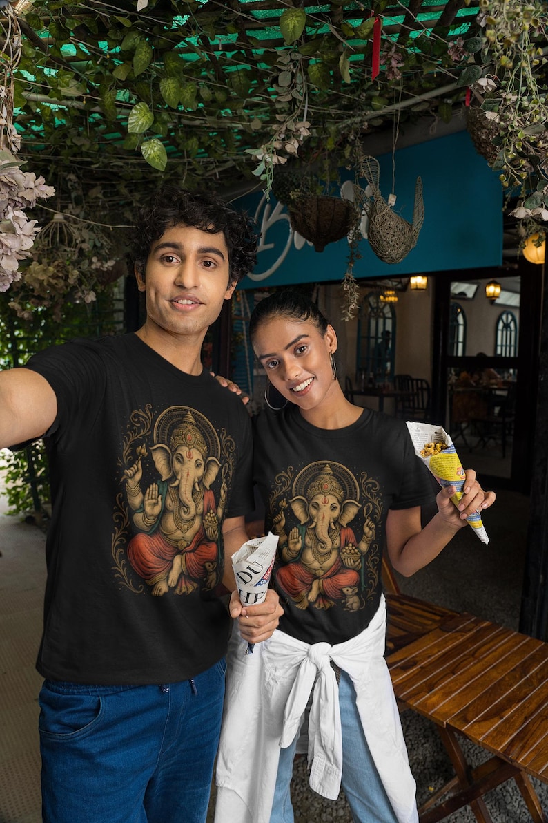 Spiritual Ganesha T-shirt featuring Hindu Elephant God design. Perfect for yoga, meditation, and spiritual gifts. Boho Indian graphic tee celebrating divine feminine energy and peaceful vibes.