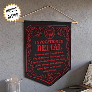 May include: Black wall banner with red text and decorative flourishes. The text reads "INVOCATION TO BELIAL" and includes a summoning prayer. A wooden dowel and string are used for hanging. The words "UNIQUE DESIGN" are in a starburst.