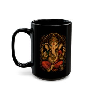 Black Ganesha Mug featuring Hindu Elephant God design, perfect for yoga lovers and spiritual gifts. Boho Indian graphic print. Available in 11oz and 15oz sizes. Ideal for tea or coffee, a unique addition to your collection