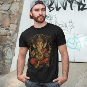 Spiritual Ganesha T-shirt featuring Hindu Elephant God design. Perfect for yoga, meditation, and spiritual gifts. Boho Indian graphic tee celebrating divine feminine energy and peaceful vibes.