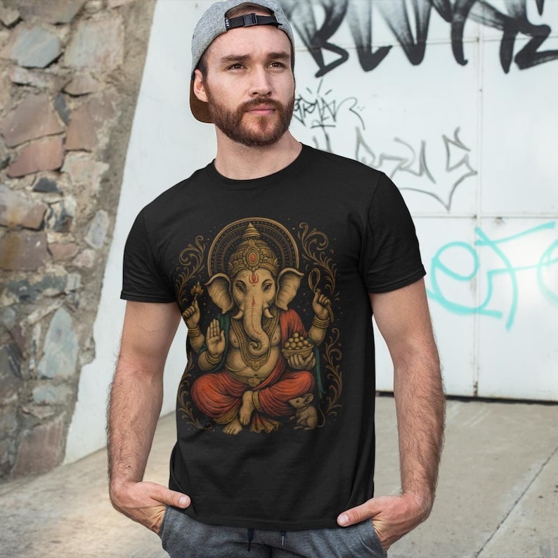 Spiritual Ganesha T-shirt featuring Hindu Elephant God design. Perfect for yoga, meditation, and spiritual gifts. Boho Indian graphic tee celebrating divine feminine energy and peaceful vibes.