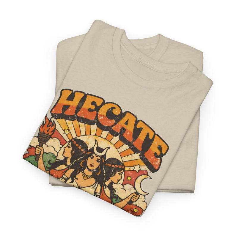 Vintage 70s Hecate retro shirt featuring the Triple Goddess in a mystical boho design, inspired by witchcraft, Wiccan and pagan spirituality. This witchy graphic tee shows Hekate with moon phases and occult symbols, perfect for spiritual women, witches, and lovers of magic. Ideal witchy gift for Wiccan, pagan and boho aesthetic fans.