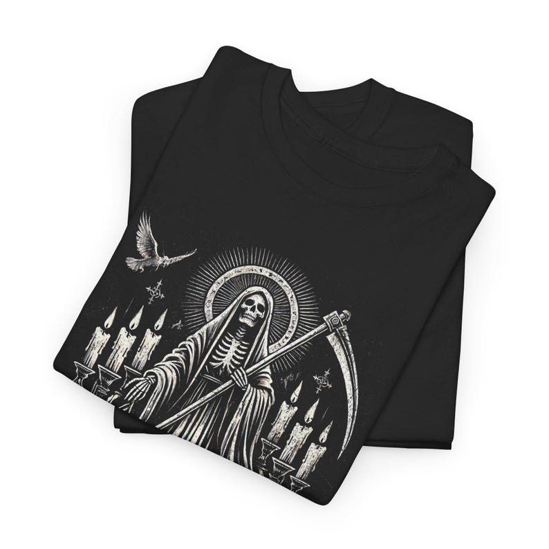 Santa Muerte Gothic Shirt - Holy Death T-Shirt featuring Day of the Dead skull design. Perfect Mexican folk art skeleton top for Dia de los Muertos celebrations or as a unique gift idea. Stylish and symbolic gothic tee for fans of Santa Muerte.