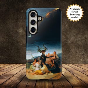 May include: A phone case featuring a dark, dramatic painting of a group of people gathered around a horned figure with a crown of leaves. The painting is set against a stormy sky with a crescent moon.