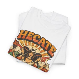 Vintage 70s Hecate retro shirt featuring the Triple Goddess in a mystical boho design, inspired by witchcraft, Wiccan and pagan spirituality. This witchy graphic tee shows Hekate with moon phases and occult symbols, perfect for spiritual women, witches, and lovers of magic. Ideal witchy gift for Wiccan, pagan and boho aesthetic fans.
