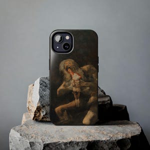 iPhone case featuring Goya's 'Saturn Devouring His Son,' printed with vivid detail. Made from durable materials, it protects your phone from scratches and damage. A perfect gift for art lovers or anyone seeking a unique, artistic phone accessory.