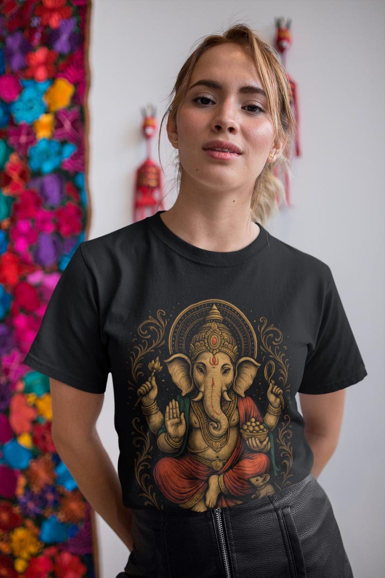 Spiritual Ganesha T-shirt featuring Hindu Elephant God design. Perfect for yoga, meditation, and spiritual gifts. Boho Indian graphic tee celebrating divine feminine energy and peaceful vibes.