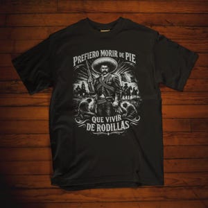 Emiliano Zapata unisex t-shirt featuring a powerful illustrated portrait of the Mexican revolutionary leader, inspired by the Mexican Revolution. This rebel spirit history shirt honors Emiliano Zapata’s fight for justice, land reform, and freedom, celebrating Latin heritage, revolutionary symbolism, and iconic Mexican history in a bold, striking design.