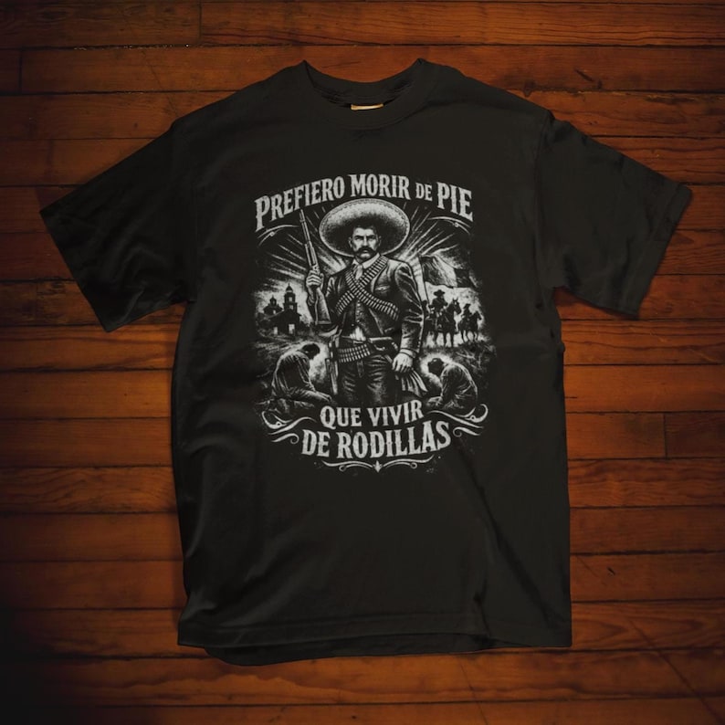 Emiliano Zapata unisex t-shirt featuring a powerful illustrated portrait of the Mexican revolutionary leader, inspired by the Mexican Revolution. This rebel spirit history shirt honors Emiliano Zapata’s fight for justice, land reform, and freedom, celebrating Latin heritage, revolutionary symbolism, and iconic Mexican history in a bold, striking design.