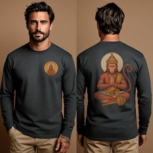 May include: Dark gray long-sleeve shirt featuring a circular graphic on the front with the word "HANUMAN" and an illustration of a seated figure. The back of the shirt displays a larger illustration of a deity with a halo.