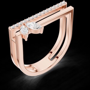 May include: Rose gold ring with a unique geometric design. The ring features a row of small, clear stones along a straight bar, and two larger, marquise-cut stones. The ring has a double band design.