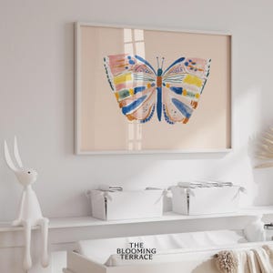 Hand-painted butterfly with bold brushstrokes in orange, pink, blue, and yellow on a soft peach background. Colorful whimsical digital wall art, perfect for nursery, kids’ bedroom, or playful spring decor.